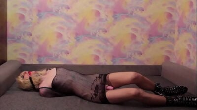 Sissy Crossdresser Bound In Armbinder And Gagged Lying On Couch
