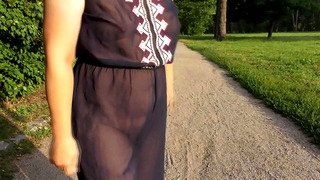 Hairy mature in transparent dress flashing in the park